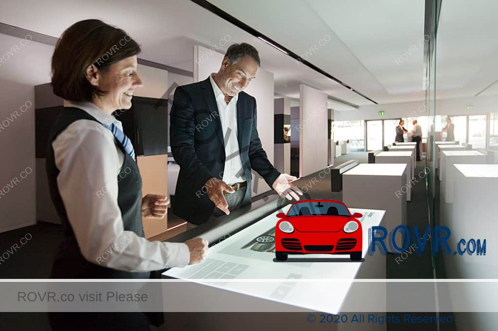 A BMW Genius works with a customer to share knowledge at the BMW Welt in Munich