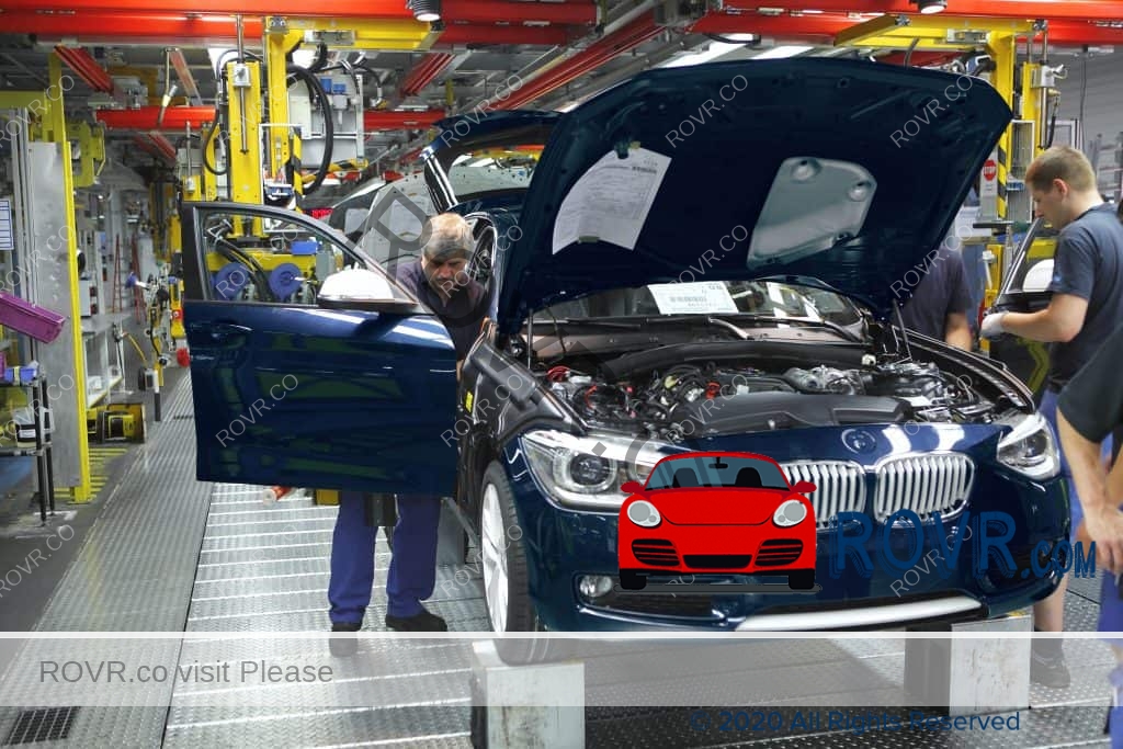 Employees assembling vehicles at the BMW Factory