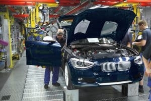 BMW Employees assembling cars on production line