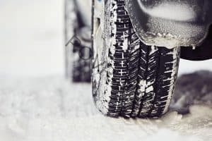 Tires on the snowy road in Winter